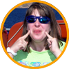 image of girl smiling and pointing at her cheeks